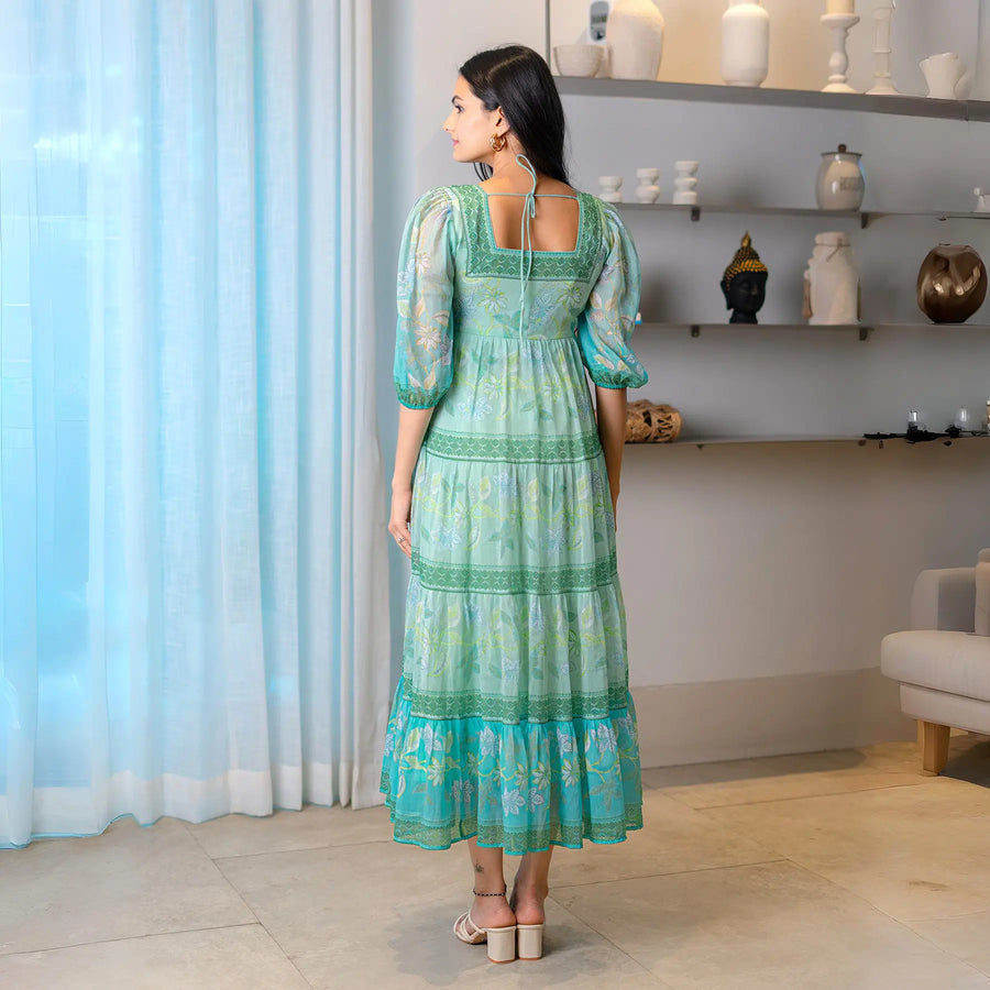 Back view of designer aqua chiffon dress for women, great for Diwali and family functions.