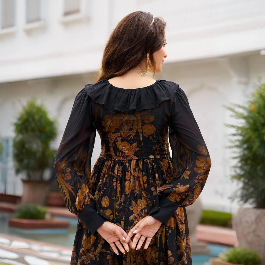 Back view of a black floral print midi dress with soft gathers and ruffles