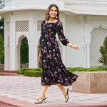Model walking confidently in floral print A-line dress, captured mid-step with a side ward glance.