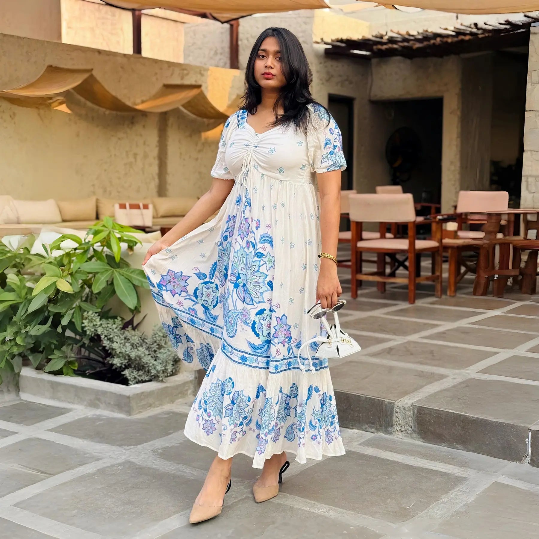 Woman walking in blue floral long maxi dress for women – breezy summer style perfect for casual wear