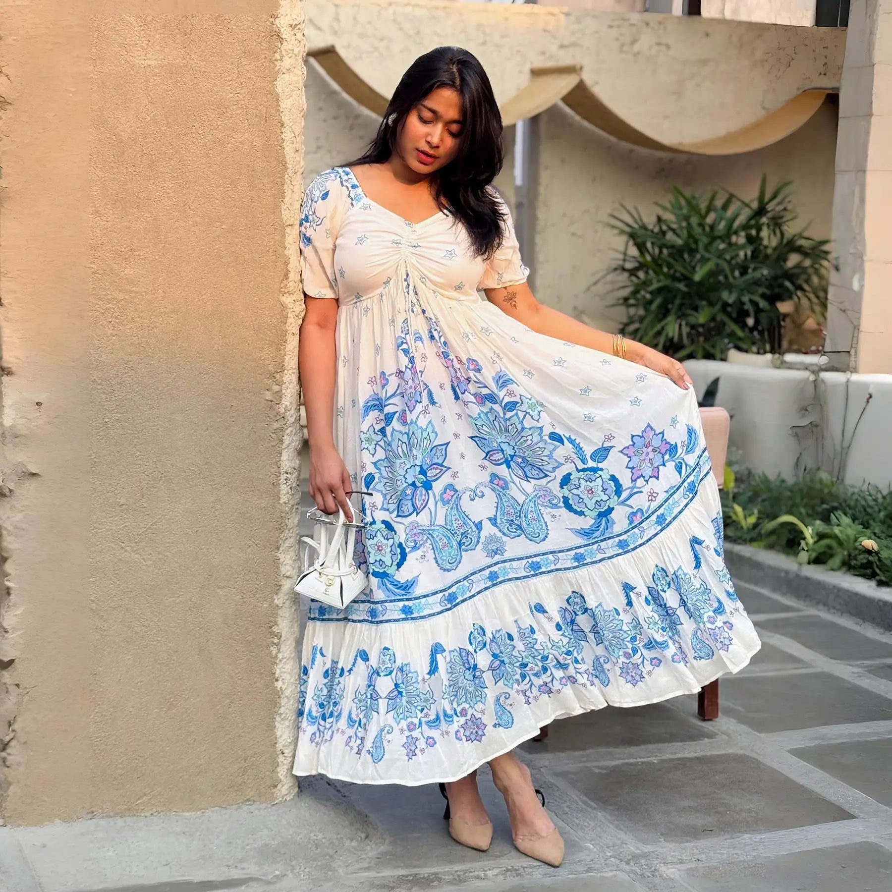 Model posing in blue floral one piece maxi dress for women – stylish option for festive wear and casual gatherings