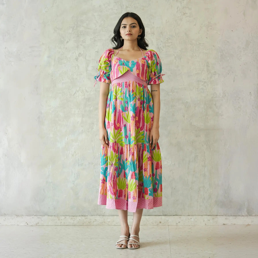 Cotton maxi dress for women with bright pink and green cactus print, front view.