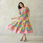 Twirling in a cotton maxi dress for women featuring a colorful cactus pattern.