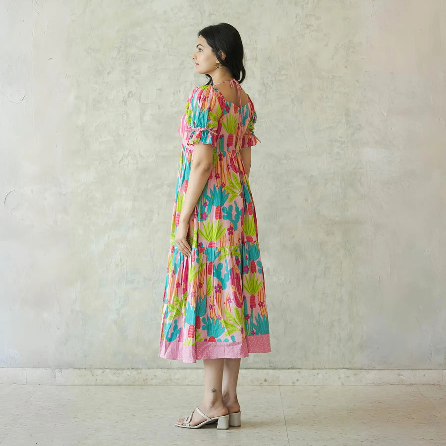 Side-back view of one piece dress for women in vibrant cactus design.
