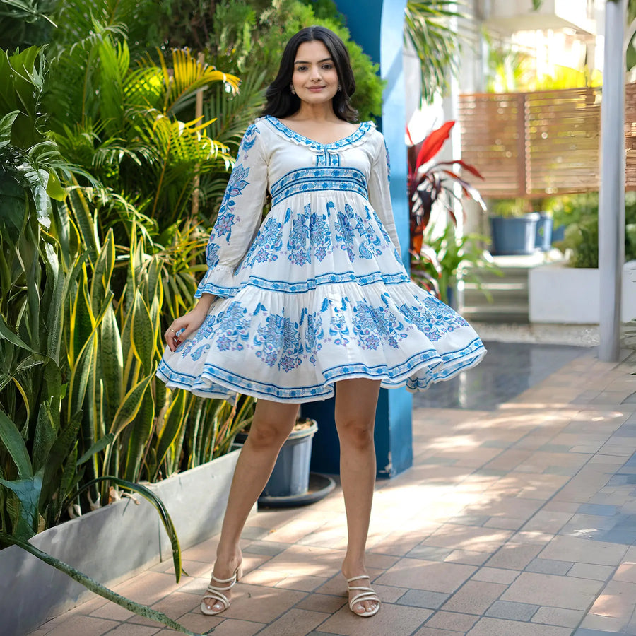 Twirl pose in a flowy short dress for women, designed for beach, summer outings and vacations.