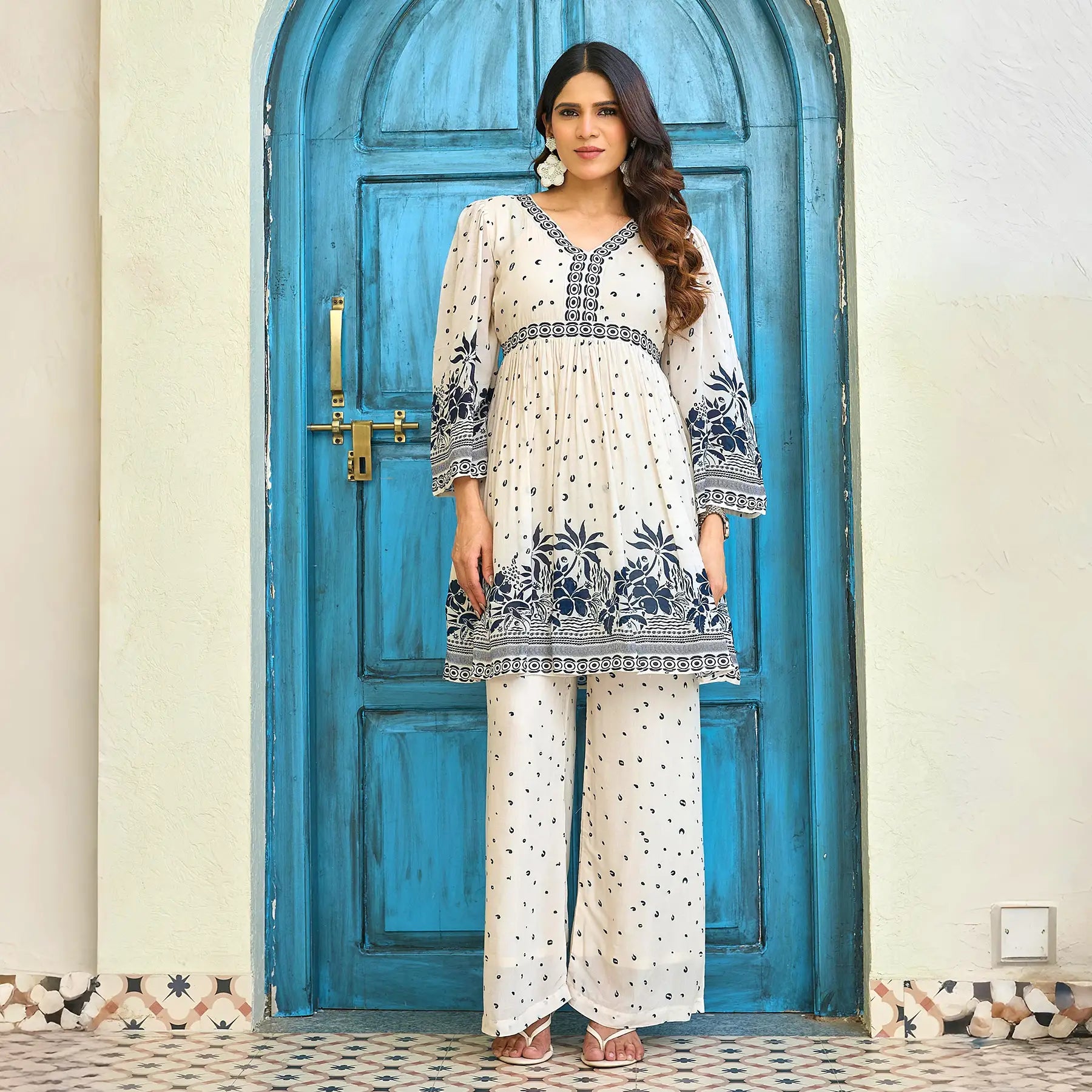 Model wearing a co-ord set for women with navy floral print and relaxed palazzo pants, perfect for brunch or casual outings.