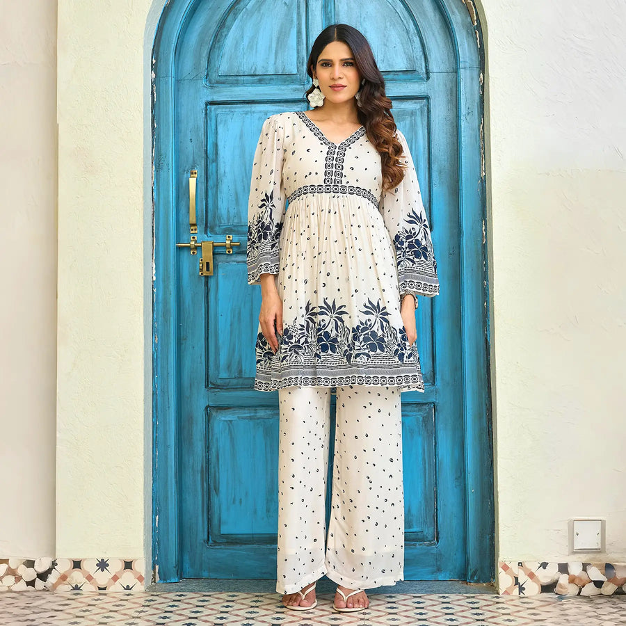 Model wearing a co-ord set for women with navy floral print and relaxed palazzo pants, perfect for brunch or casual outings.