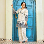 Side pose showing the white co ord set with print details, ideal for vacation, brunches.