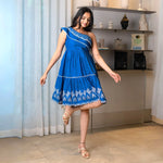 Playful twirl pose in a vibrant indigo short dress for women, perfect for summer outings and casual gatherings