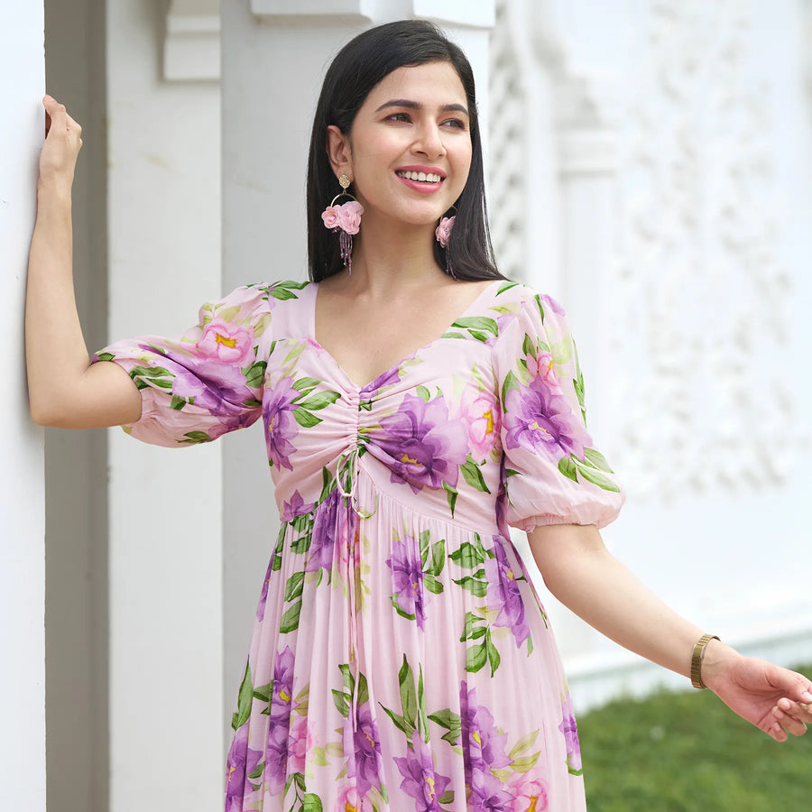 Smiling woman in a floral midi dress – a charming sundress for summer or beach days.