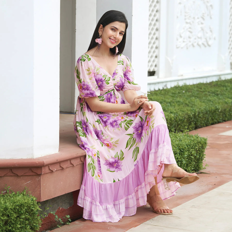 Sitting pose in a floral midi dress – soft, breathable beach dress for women.