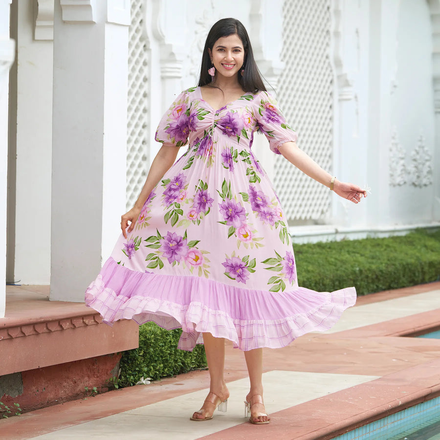 Floral midi dress for women with twirling pose – perfect for summer vacations and beach getaways.