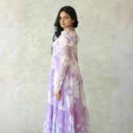 Lavender midi dress back view with floral print and puff sleeves