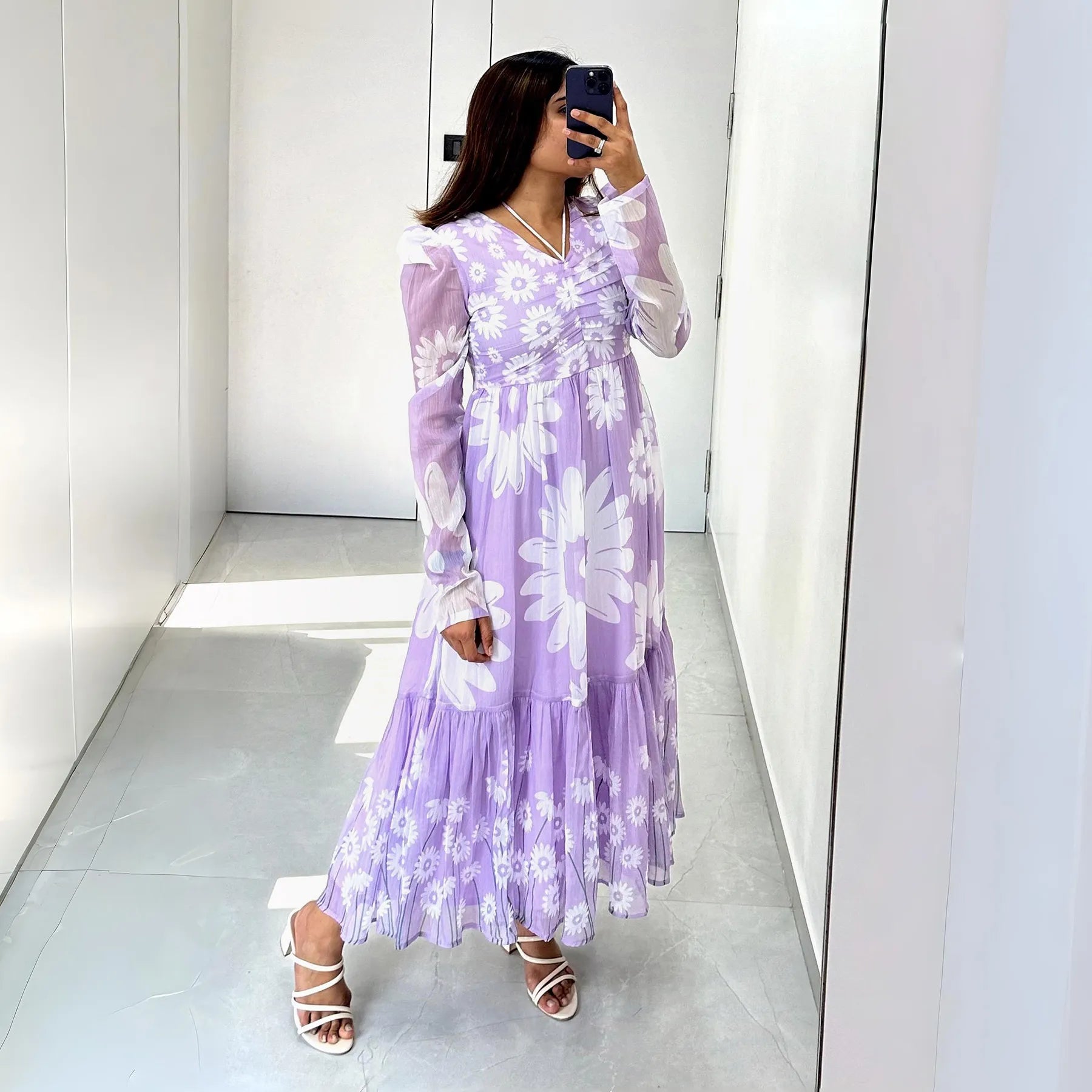 Mirror selfie wearing Lavender Daisy Dreams floral maxi dress, ideal for vacation photos and relaxed summer days