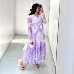 Mirror selfie wearing lavender floral midi dress for women