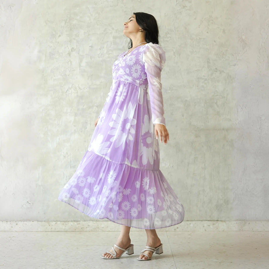 Side view of lavender floral midi dress with sheer puff sleeves
