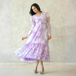 Model walking in lavender a-line floral midi dress