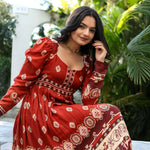 Close-up of a maroon full sleeve one piece dress, highlighting neckline and print — chic option for cultural gatherings.