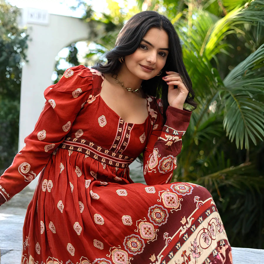 Close-up of a maroon full sleeve one piece dress, highlighting neckline and print — chic option for cultural gatherings.