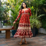 Front standing pose in a maroon long sleeve dress, styled with a handbag — perfect for festive dinners and cultural events.