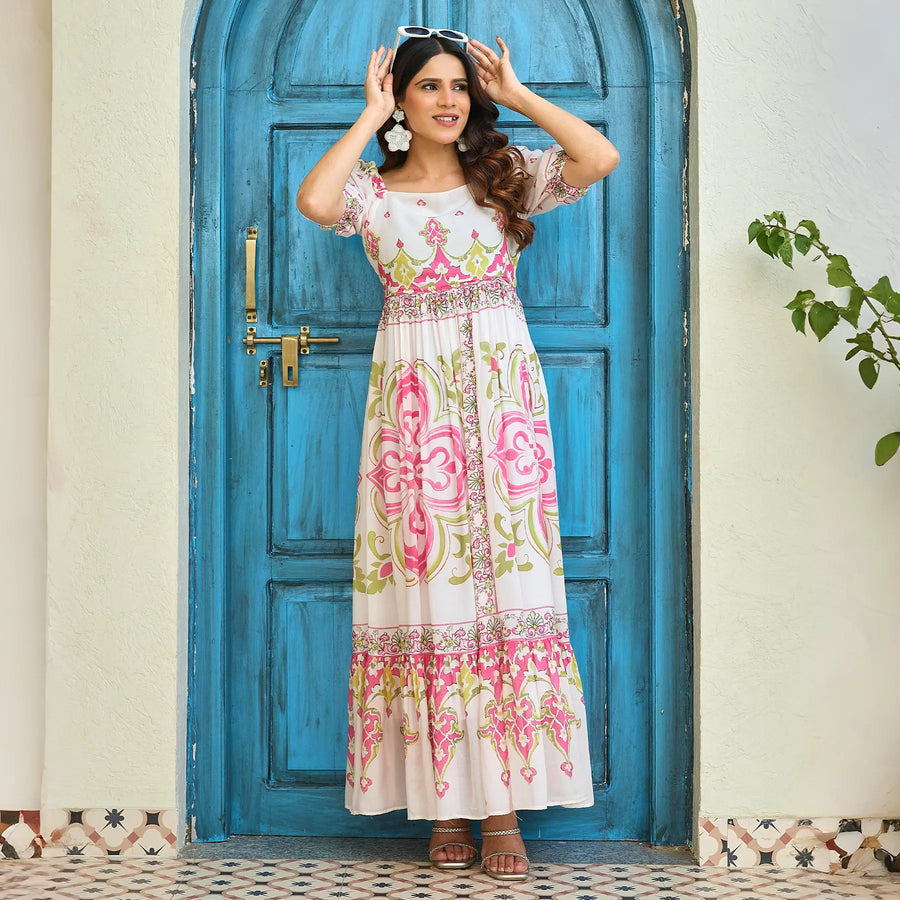 Stylish puff sleeve maxi dress with heritage print, model posing with sunglasses, ideal for festive day events or brunches.