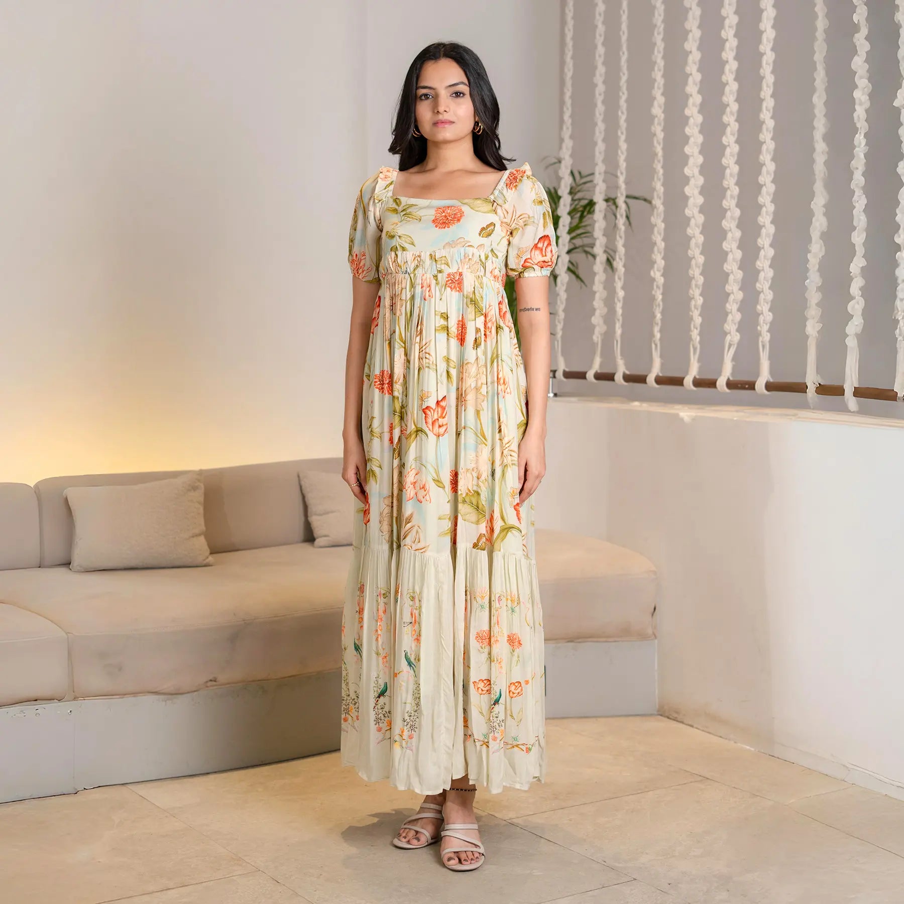 Front pose showing a floral A-line maxi styled for festive occasions and brunch outings.