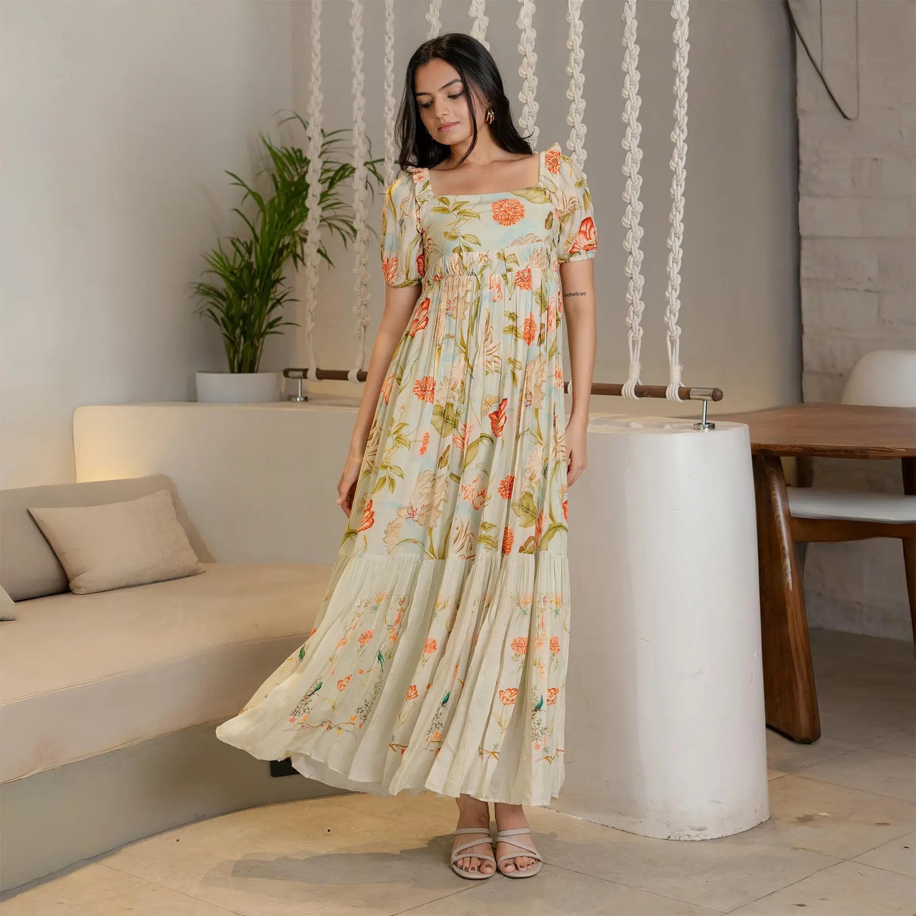 Side angle capturing the breezy flow of the Meadow Blossom floral one piece, ideal for vacations.