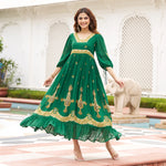 Twirling pose in a green long maxi dress  with flared hemline, ideal for Diwali festive parties and evening celebrations.