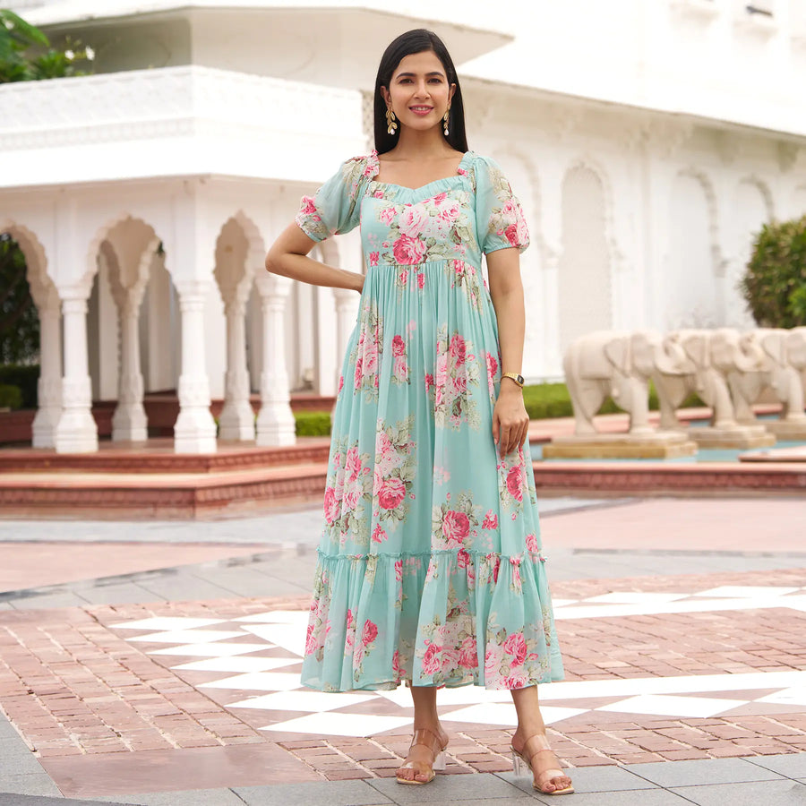 Model wearing Mint Bloom floral maxi dress with puff sleeves, ideal as a one piece beach maxi dress.