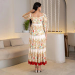 Back view highlighting the long flow of the maxi dress, a graceful choice for festive occasions.