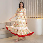 Twirl pose with the Royal Bloom A-line floral maxi dress, an elegant style ideal for birthdays and summer evenings.