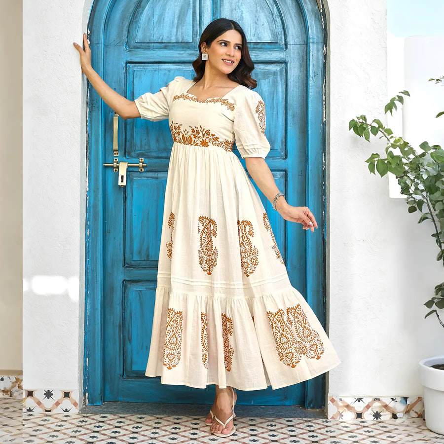 Playful angled pose highlighting the tiered hem and soft fabric of this summer maxi dress.