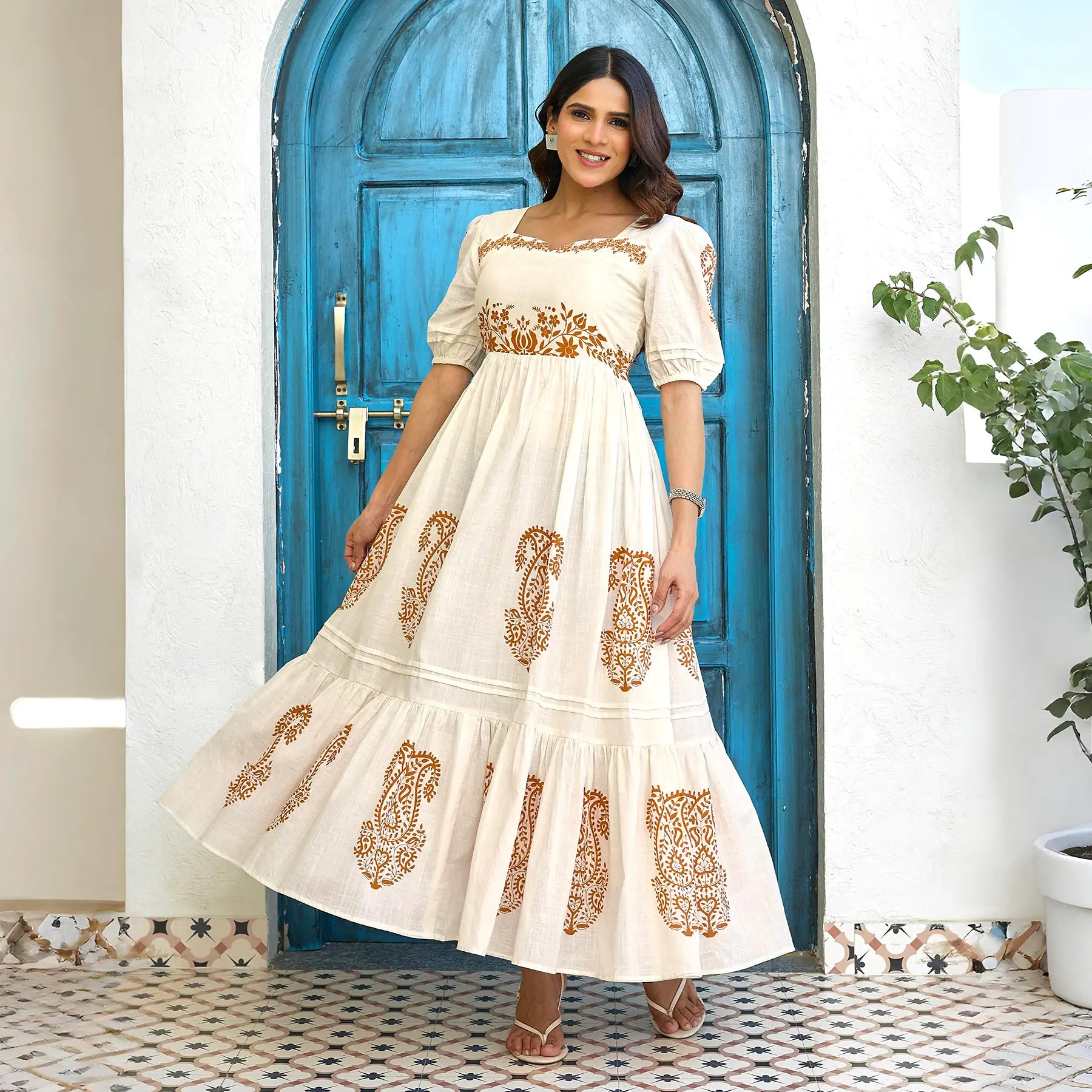 Twirl pose showing the flowy flare of this long summer dress – ideal for brunch dates and resort wear.