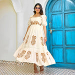 Vacation-ready look with sunglasses styled with this flowy maxi dress – a chic pick for resort stays.