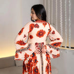 Close-up back view of the Saffron Valley floral maxi dress with bell sleeves, crafted for elegant occasions.