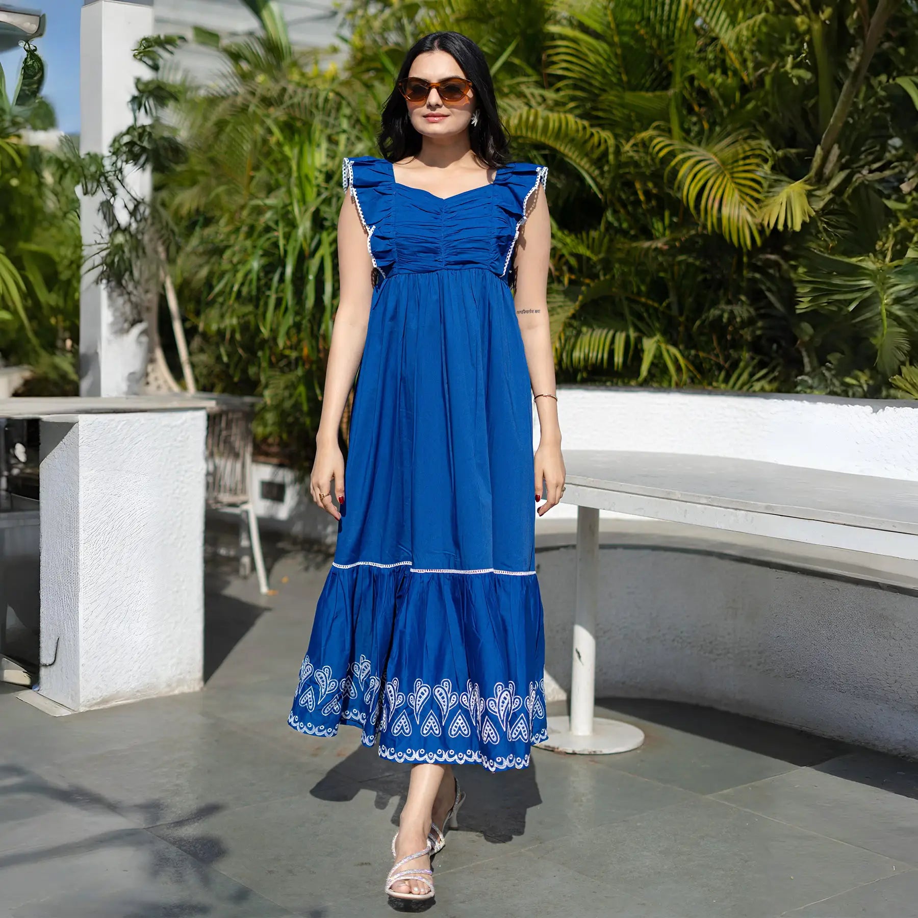 Straight pose showing long maxi dress with flowy hemline and relaxed fit.