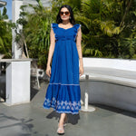 Straight pose showing long maxi dress with flowy hemline and relaxed fit.