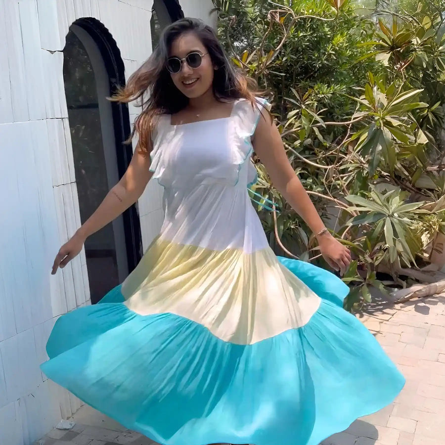 Influencer twirling in a long beach dress, flared skirt creating breezy summer vibe.