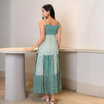 Back view of an A-line maxi dress with strappy neckline — chic choice for holiday dinners and vacation styling.