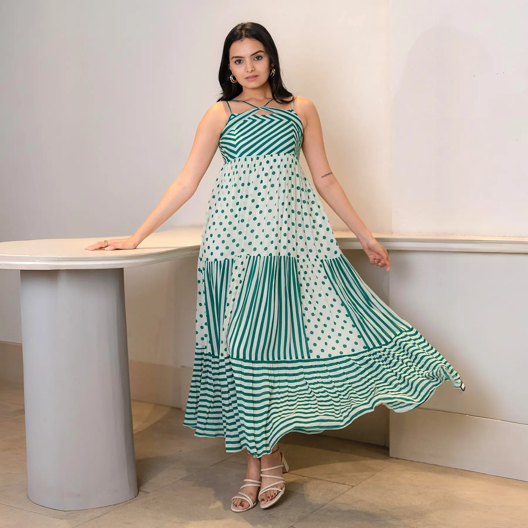 Model in a sleeveless maxi dress for women, front pose with flowy hemline — ideal for vacations and brunch outings.