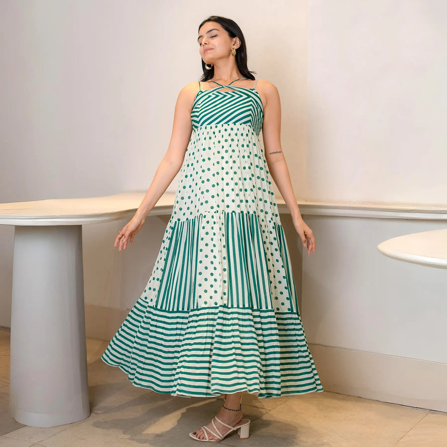 Relaxed lifestyle pose in a summer maxi dress, eyes closed and arms out — great for beach side cafés and resort wear.