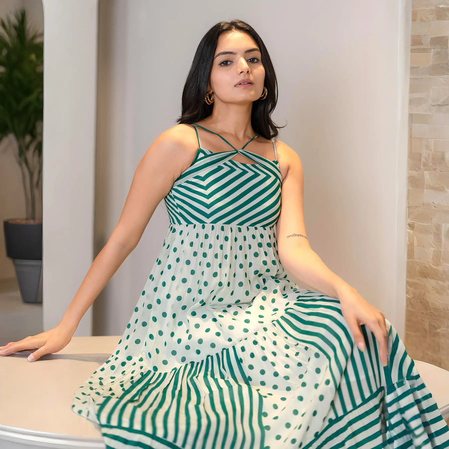 Seated close-up in a sleeveless maxi dress, highlighting neckline and straps — stylish pick for birthday brunches.
