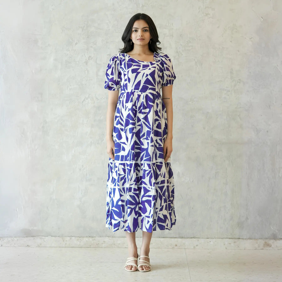 Model in Abstract print midi dress for women with puff sleeves, perfect for a chic summer look.
