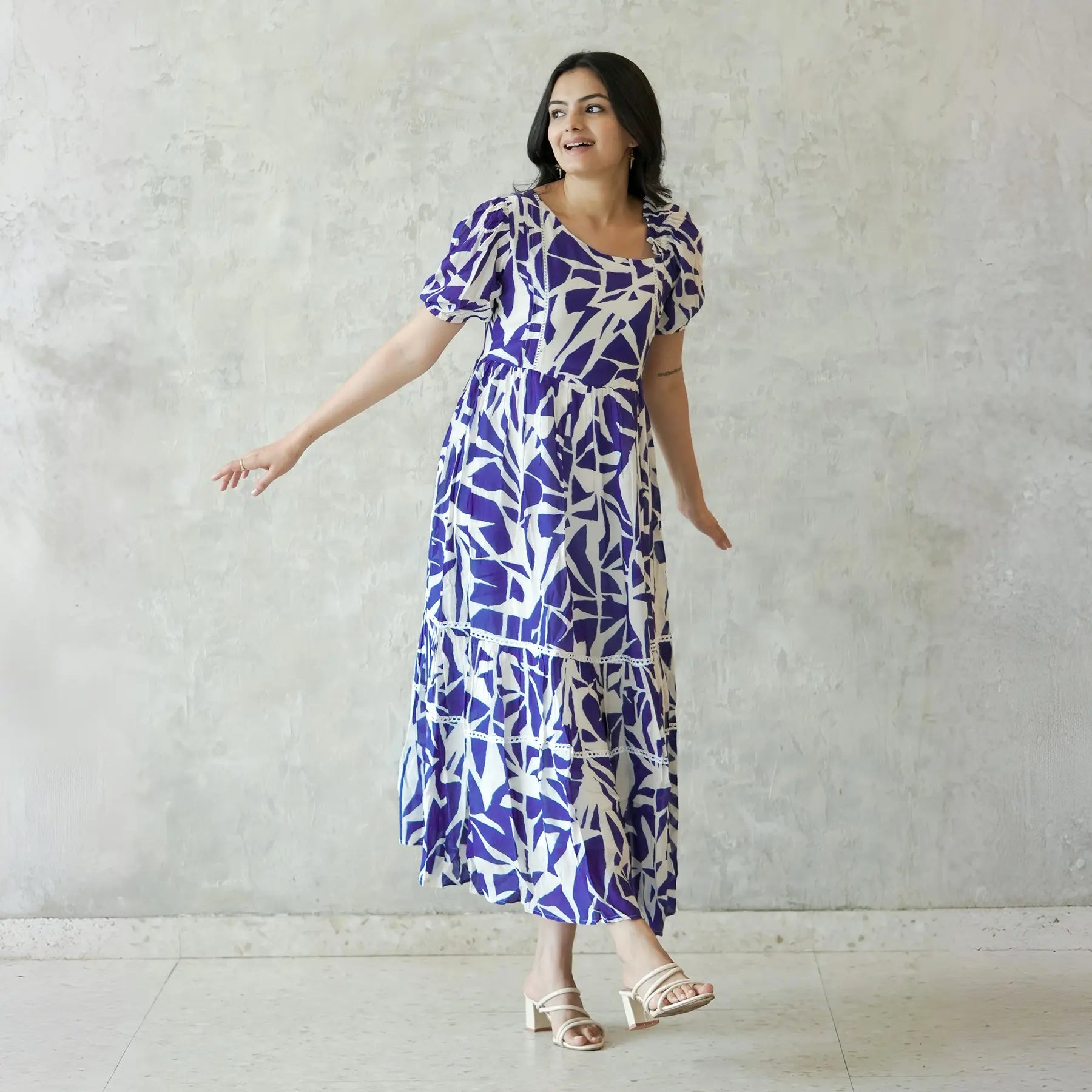 Model walking in A-Line midi dress for women, featuring puff sleeves and flowy silhouette for a relaxed day outing.