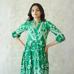Close-up of neckline and sleeve details in a green western one piece dress.