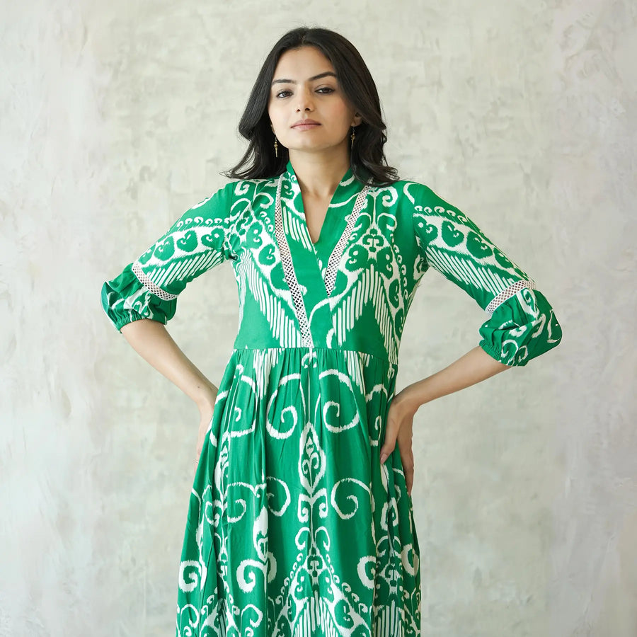 Close-up of neckline and sleeve details in a green western one piece dress.