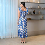Back view of sleeveless leafy midi dress with tie-up detail, designed for comfort and elegance.