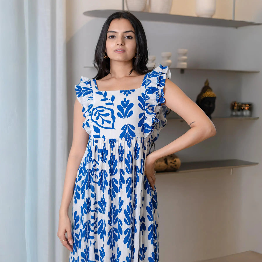 A-line leafy print midi dress with frilled sleeves, styled for summer brunches and relaxed outings.