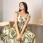 Close-up of leafy print sleeveless midi dress highlighting the sweetheart neckline and casual summer elegance.