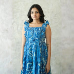 Close-up of midi dress for women with ruffled sleeves — stylish summer birthday dress option.